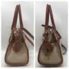Dooney & Bourke All Weather Leather bone and British tan pebbled leather buckle crossbody satchel